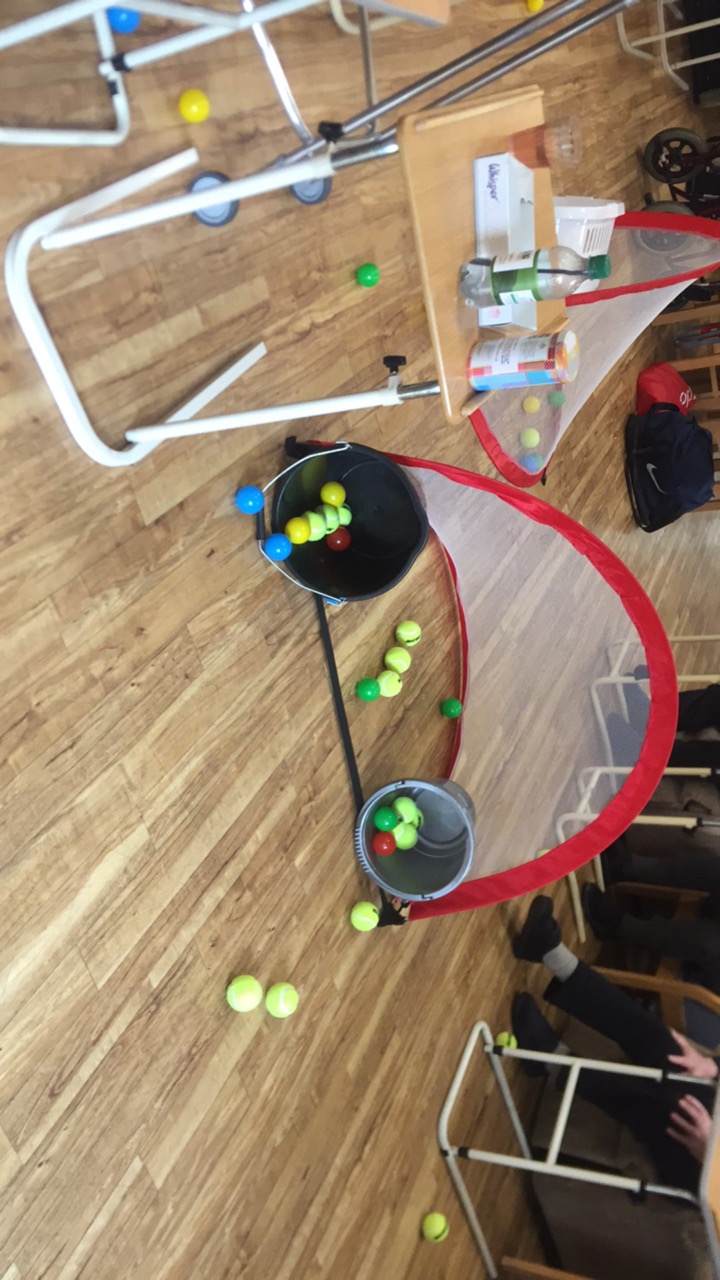 Care home wellbeing activity with ball tunnel