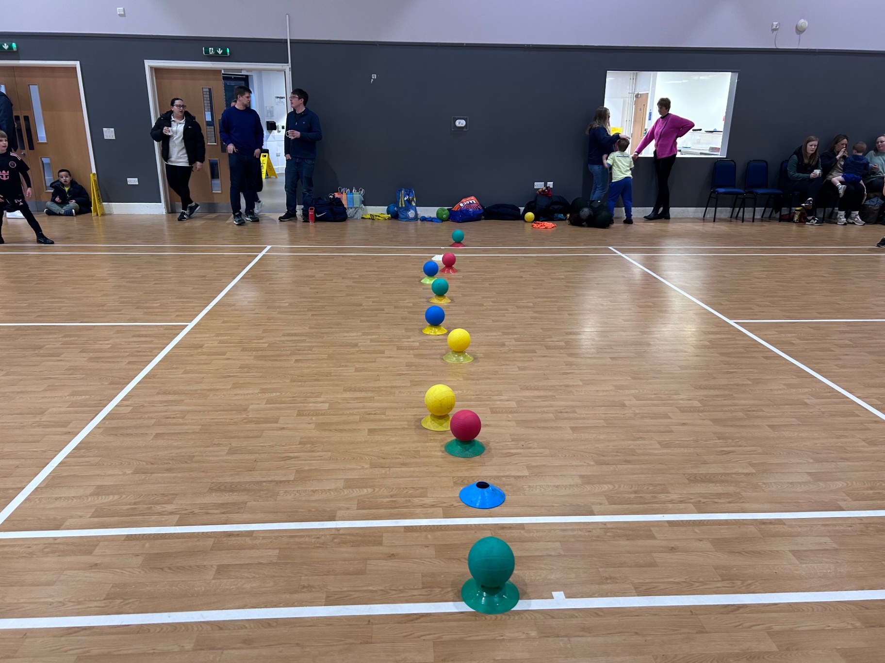 Coloured ball skills setup in indoor hall